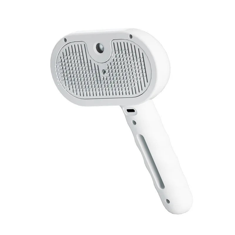 Pet grooming brush spraying fine mist while brushing a cat's fur