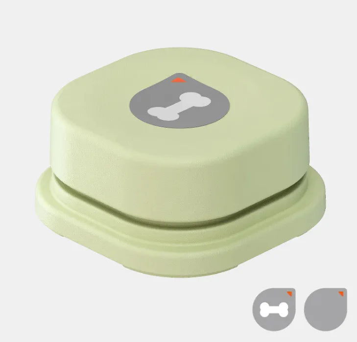 Dog using pet communication button to play recorded message